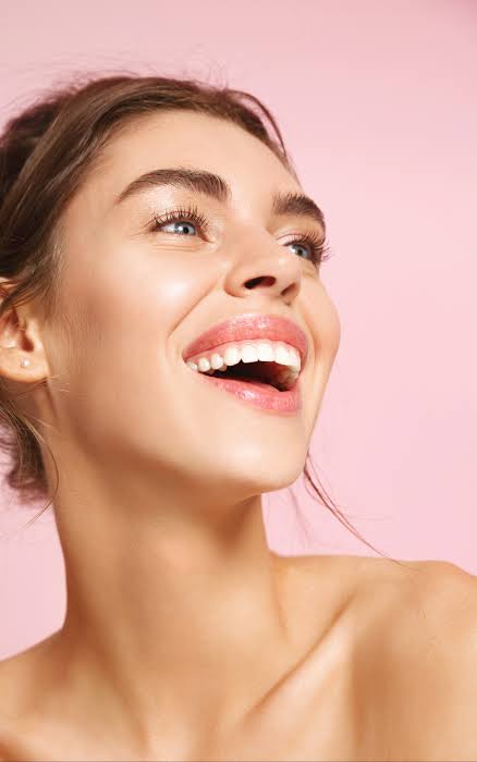 Patient laughing joyfully after treatment